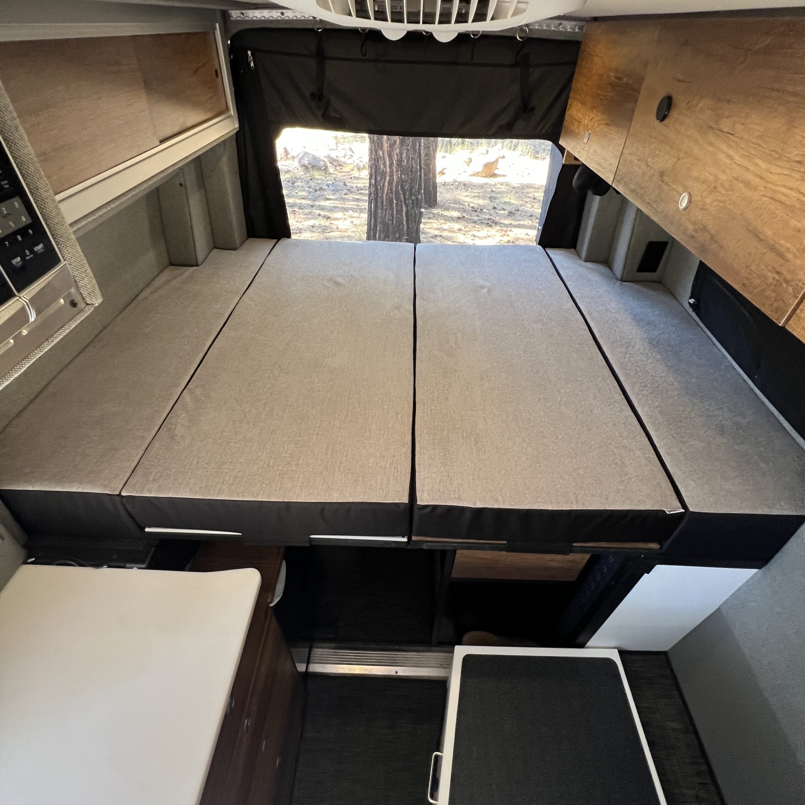 Luxe5 Cooling Memory Foam 5-inch mattress laid out flat in the rear of a Storyteller van interior.