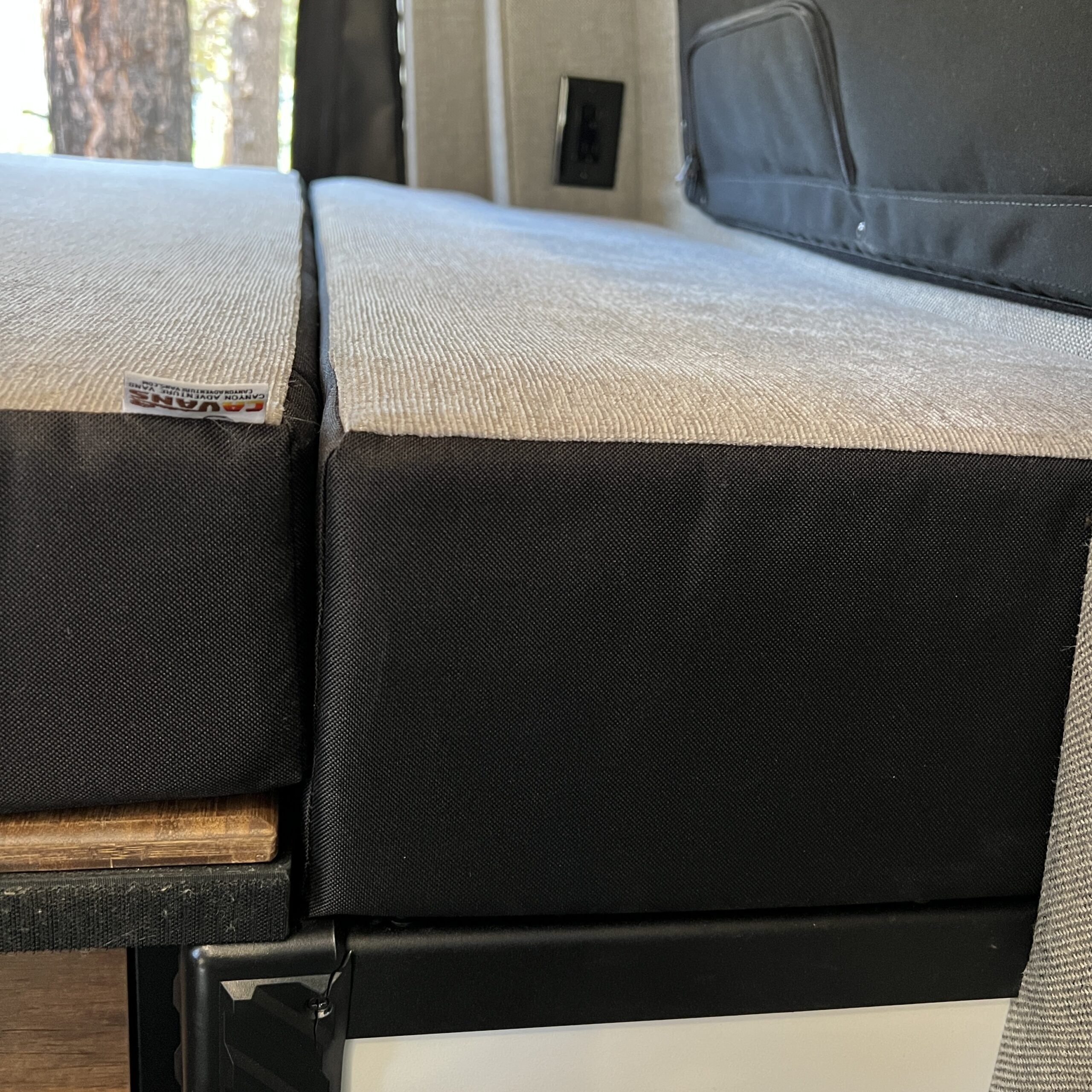 Luxe5 Cooling Memory Foam 5 mattress in a van interior with semi firm support and black fabric cover.