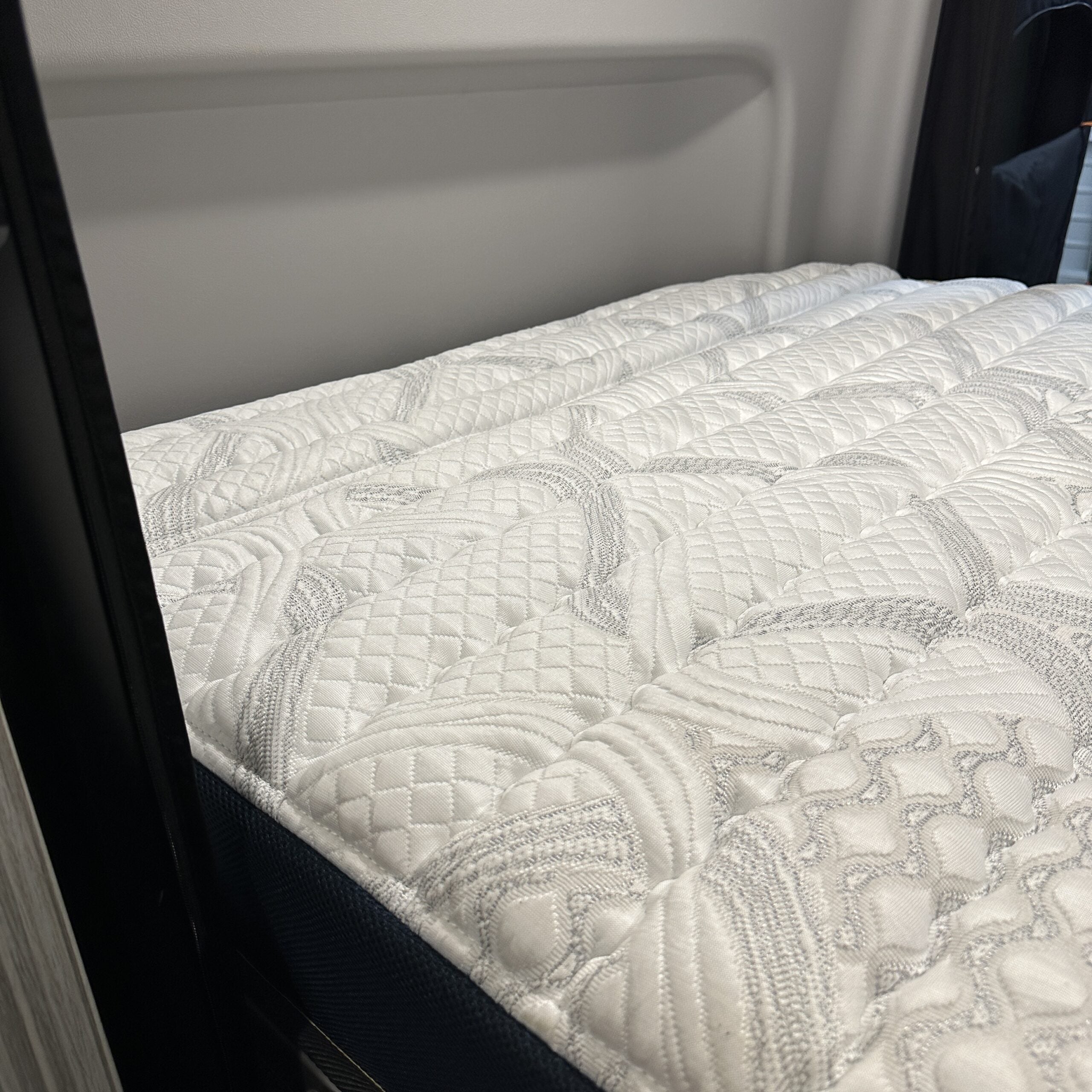 Ultra Luxe mattress by Revel shown inside a van with detailed quilted surface design.