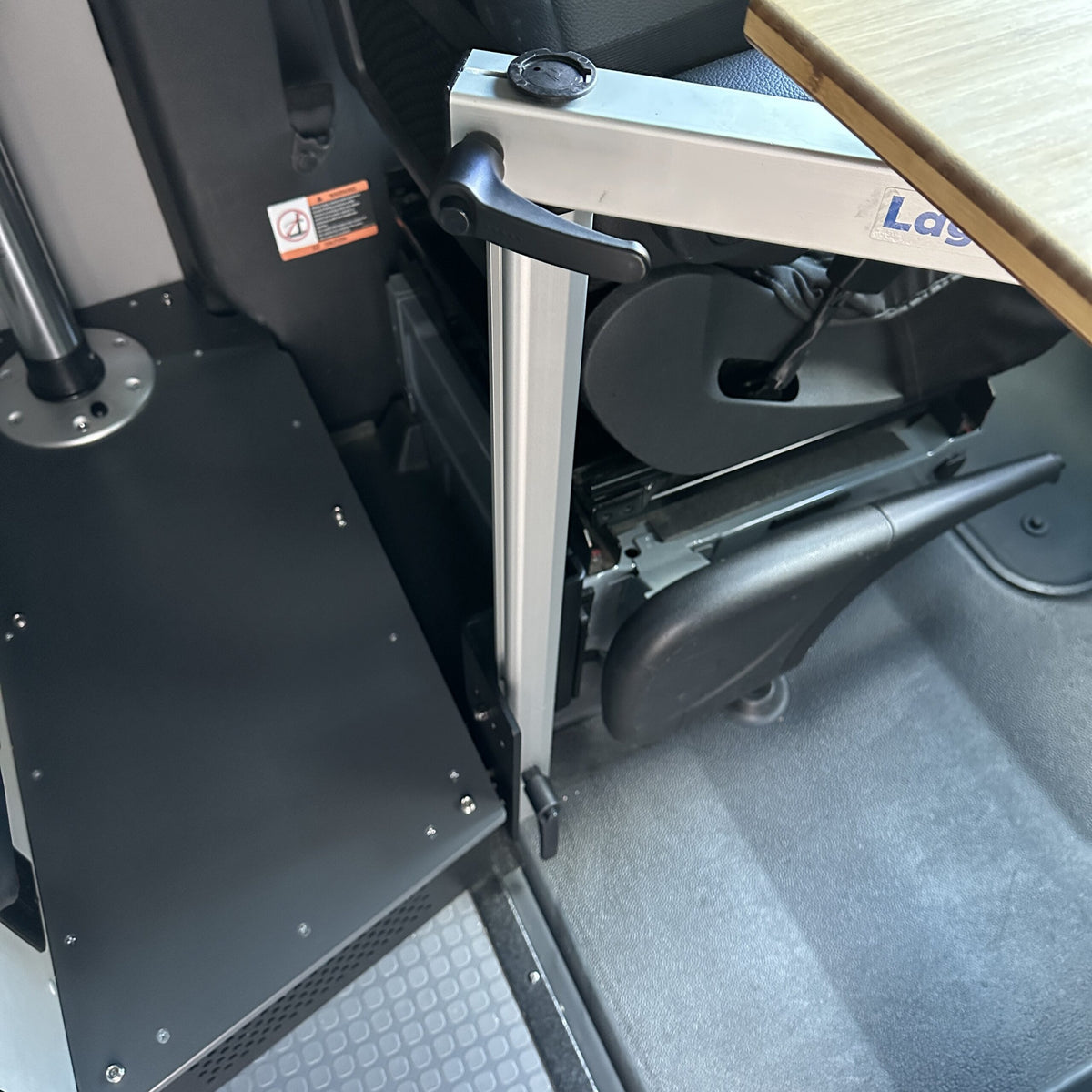 table mount Long Leg table mount installed beside a van seat with folded tabletop arm.