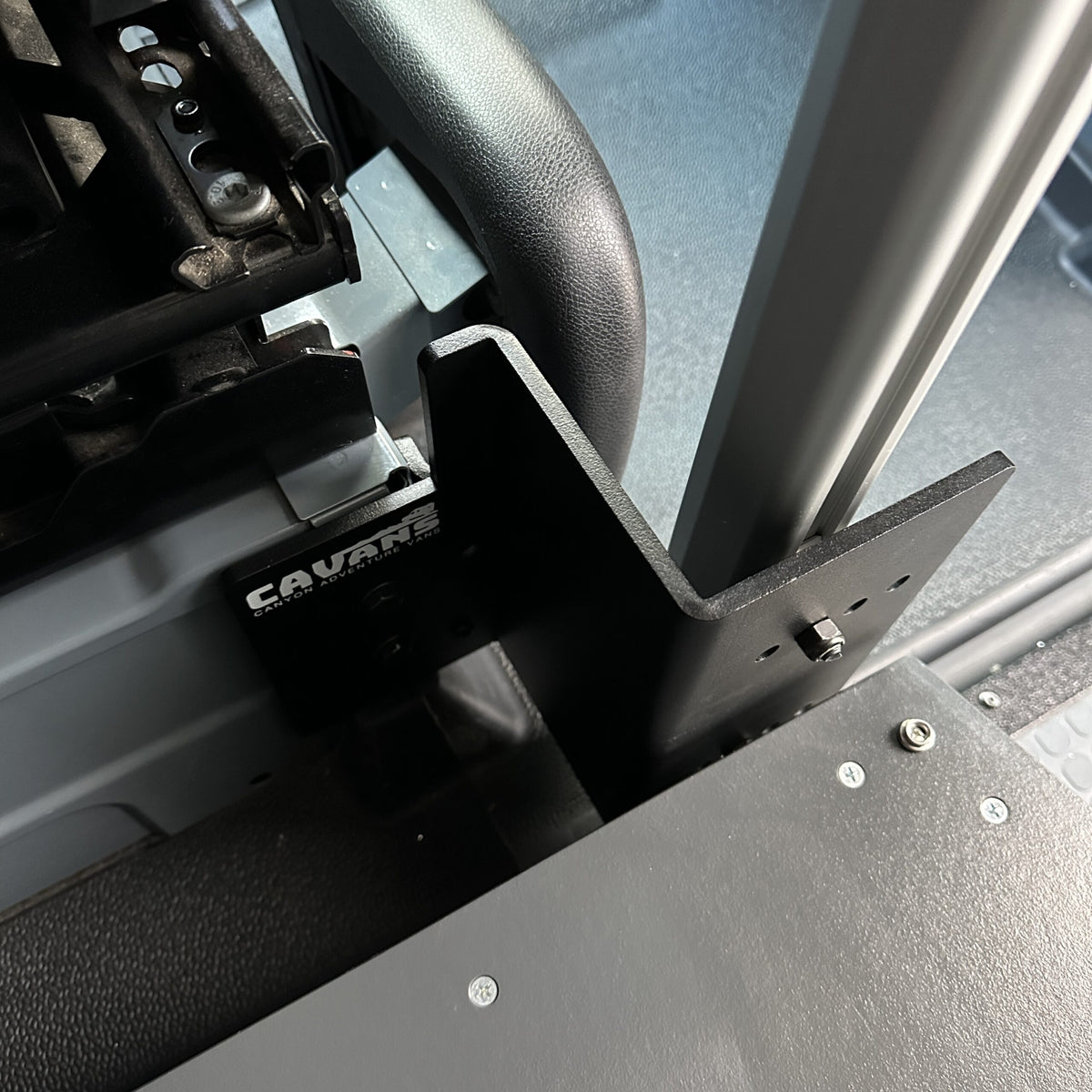 CAV console table bracket mounted inside a van near seating area.