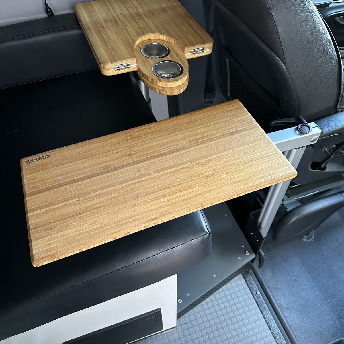 table mount Long Leg bamboo table mounted in van seating area with cupholders and swivel extension.