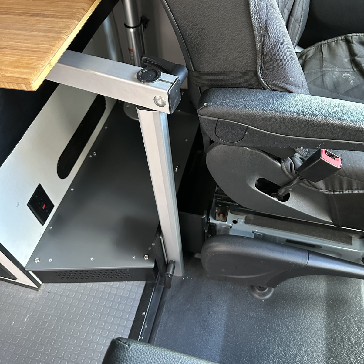 table mount Long Leg table mount installed beside van seat with swivel base visible