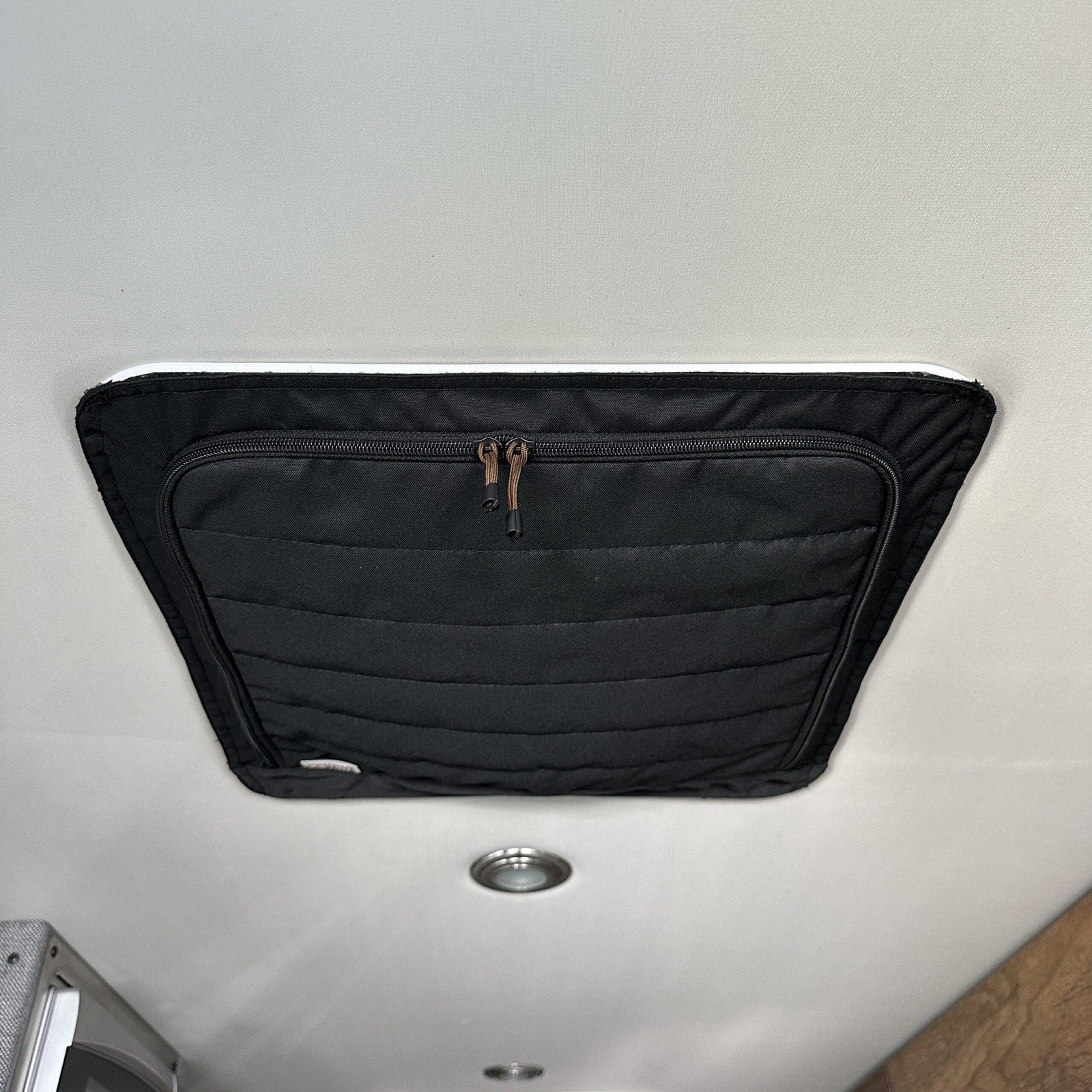 Black CLIMA-SHADE cover from the Ultimate CLIMA-SHADE Bundle installed on van ceiling vent.