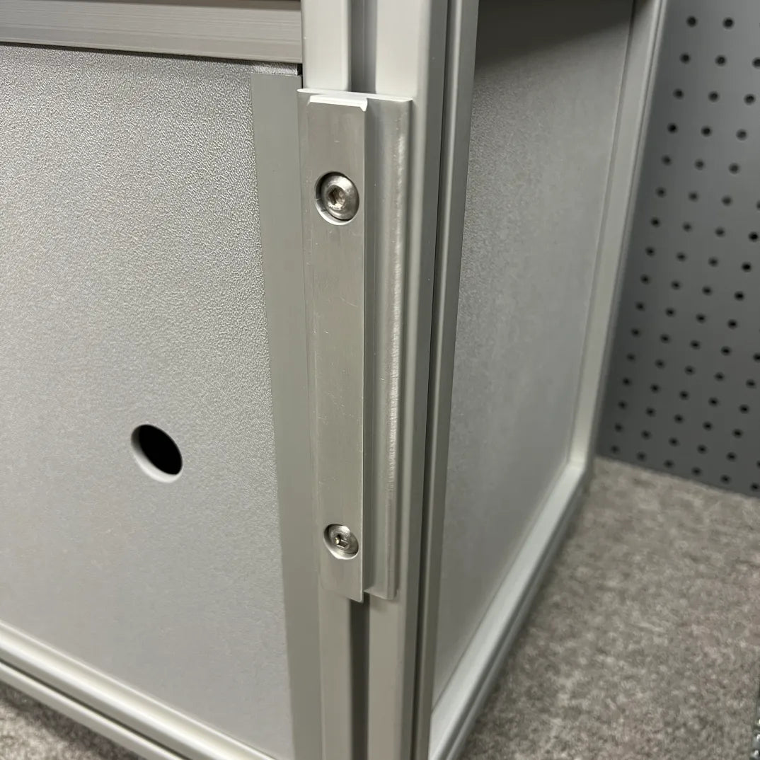Slim Bracket installed on a modular aluminum van cabinet system