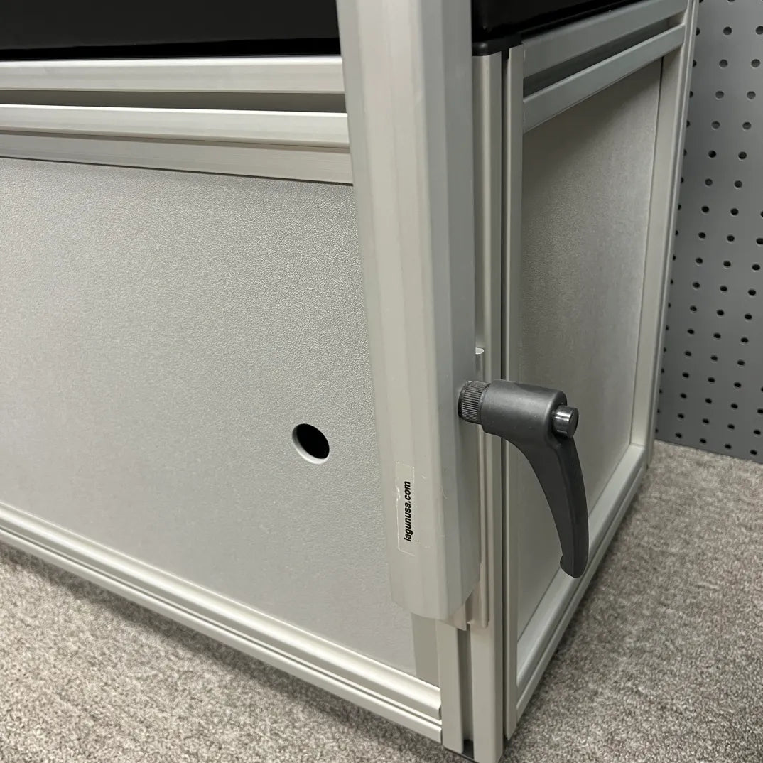 Close-up of Slim Bracket console table mount lever installed in a van interior.