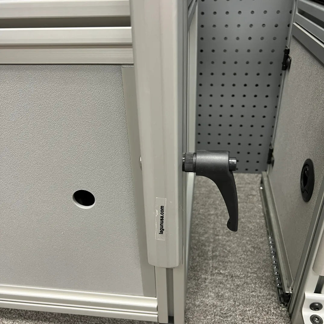 Close-up of Slim Bracket installed on van console table frame with locking handle visible