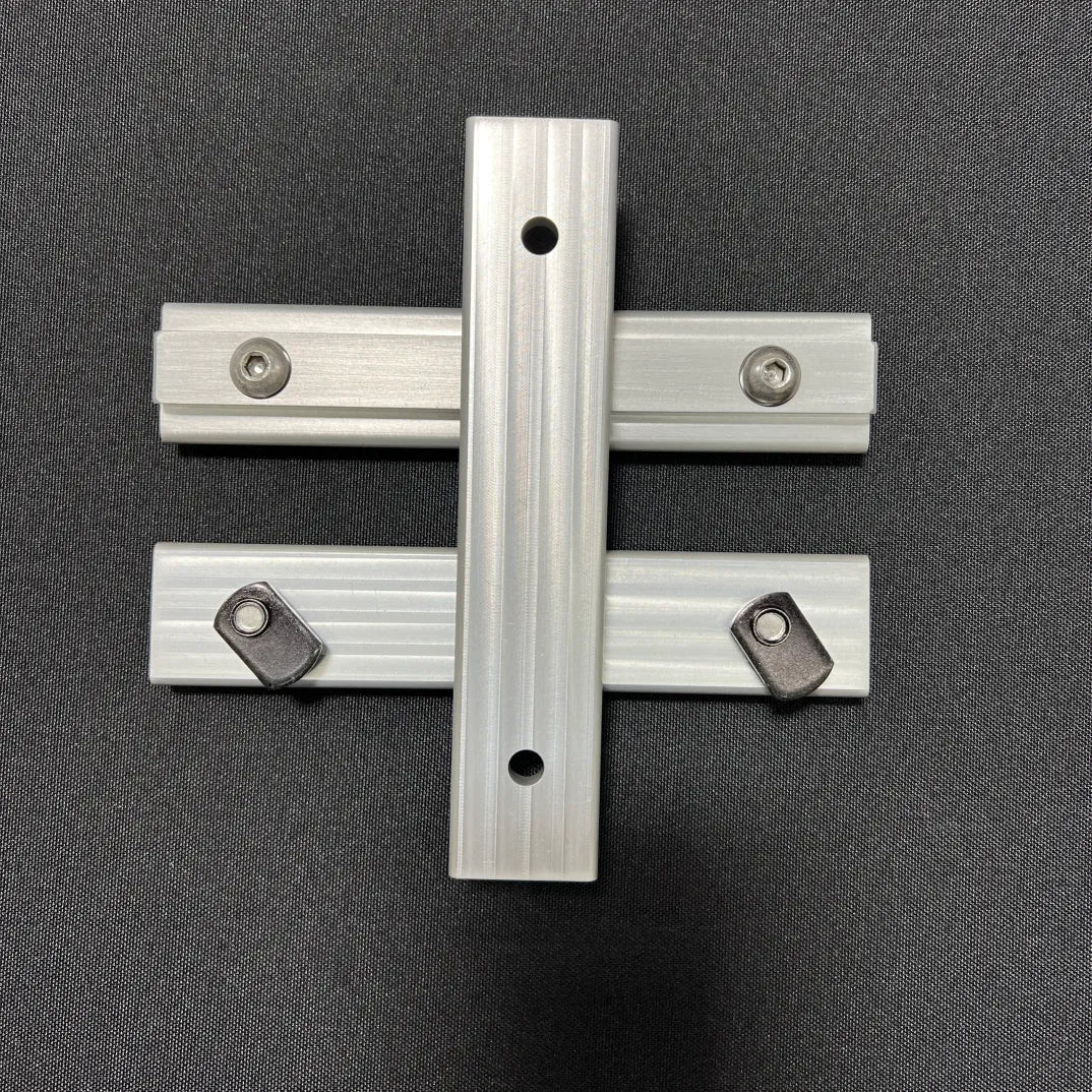 Slim bracket for van console table or table mount replacement, shown on dark surface