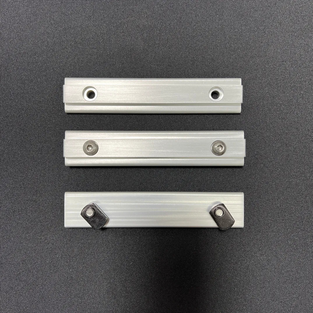 Slim Bracket replacement set for van console table or table mounts, shown on black surface