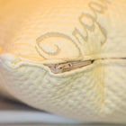 Close-up of Dream Collection adjustable pillow with visible zipper and textured fabric