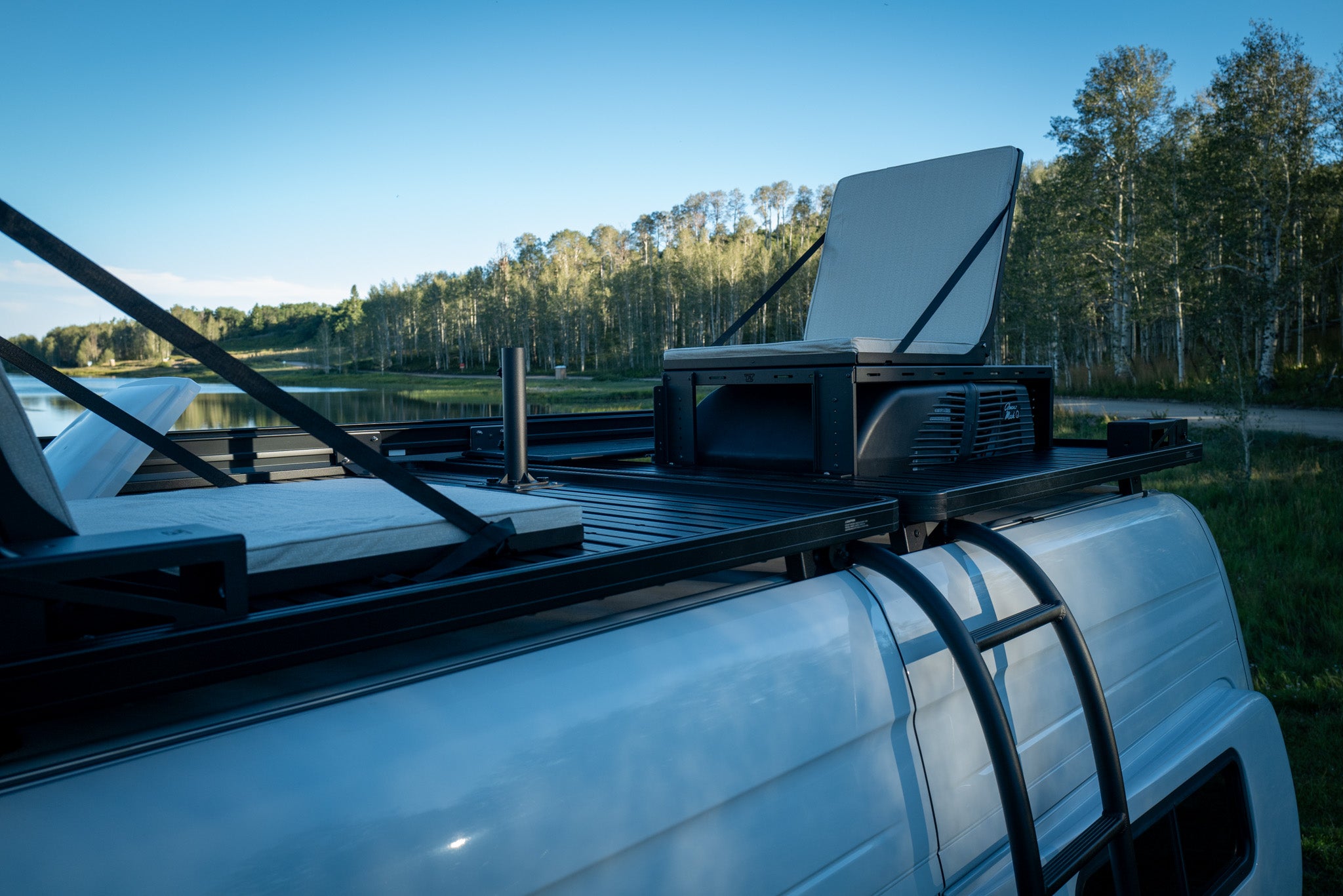 Van rooftop lounge with seats and solar light umbrella