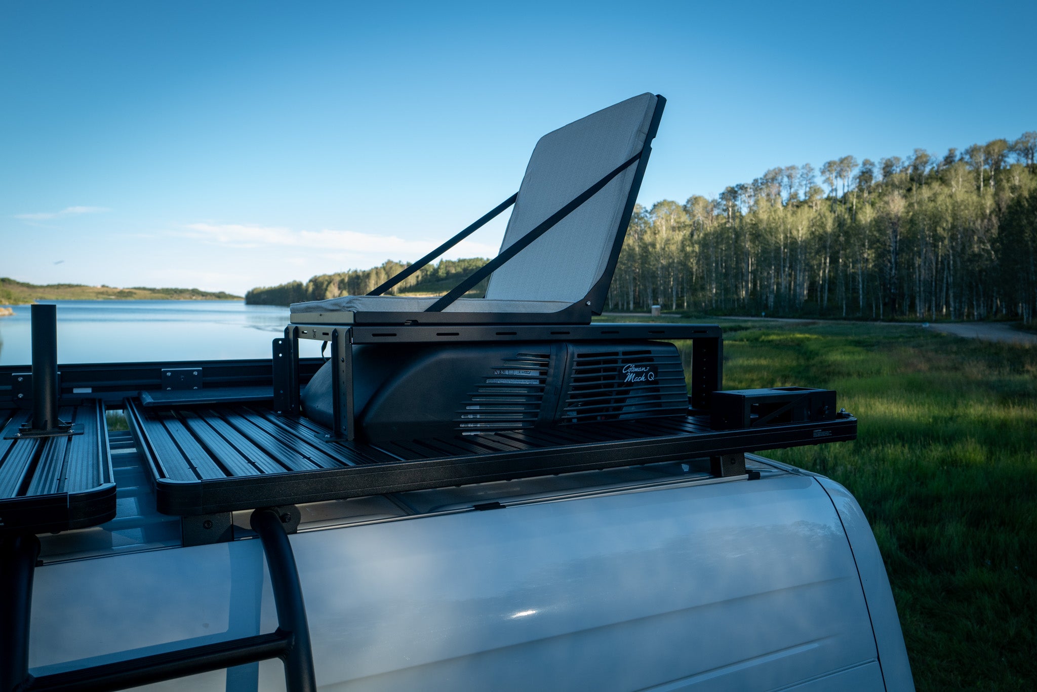 Adventure Van rooftop lounge seating with umbrella