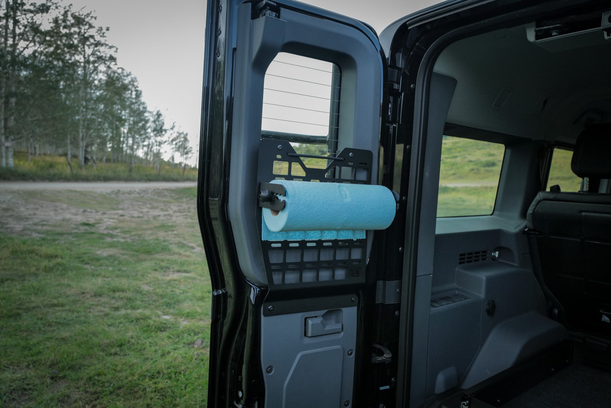 INEOS Grenadier driver rear door molle panel and storage cubby