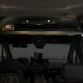 OLD CAV cab headliner shelf installed in a 2019+ Mercedes Sprinter van interior with storage items.