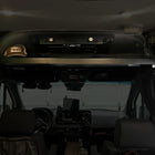 OLD CAV cab headliner shelf installed in a 2019+ Mercedes Sprinter van interior with storage items.