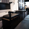 CAV Canyon Table Leg System mounted in van interior with raised tabletop arm extended