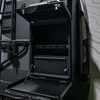 Open Canyon Drawer System by Storyteller installed on the rear of a van, with fold-down work surface.
