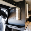 Canyon Kitchen Caddy by CAV mounted on a Storyteller van wall with shelf and Bluetooth speaker.