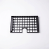 STO Undercabinet Shelf in black metal with grid design and cable cutout, viewed from above.