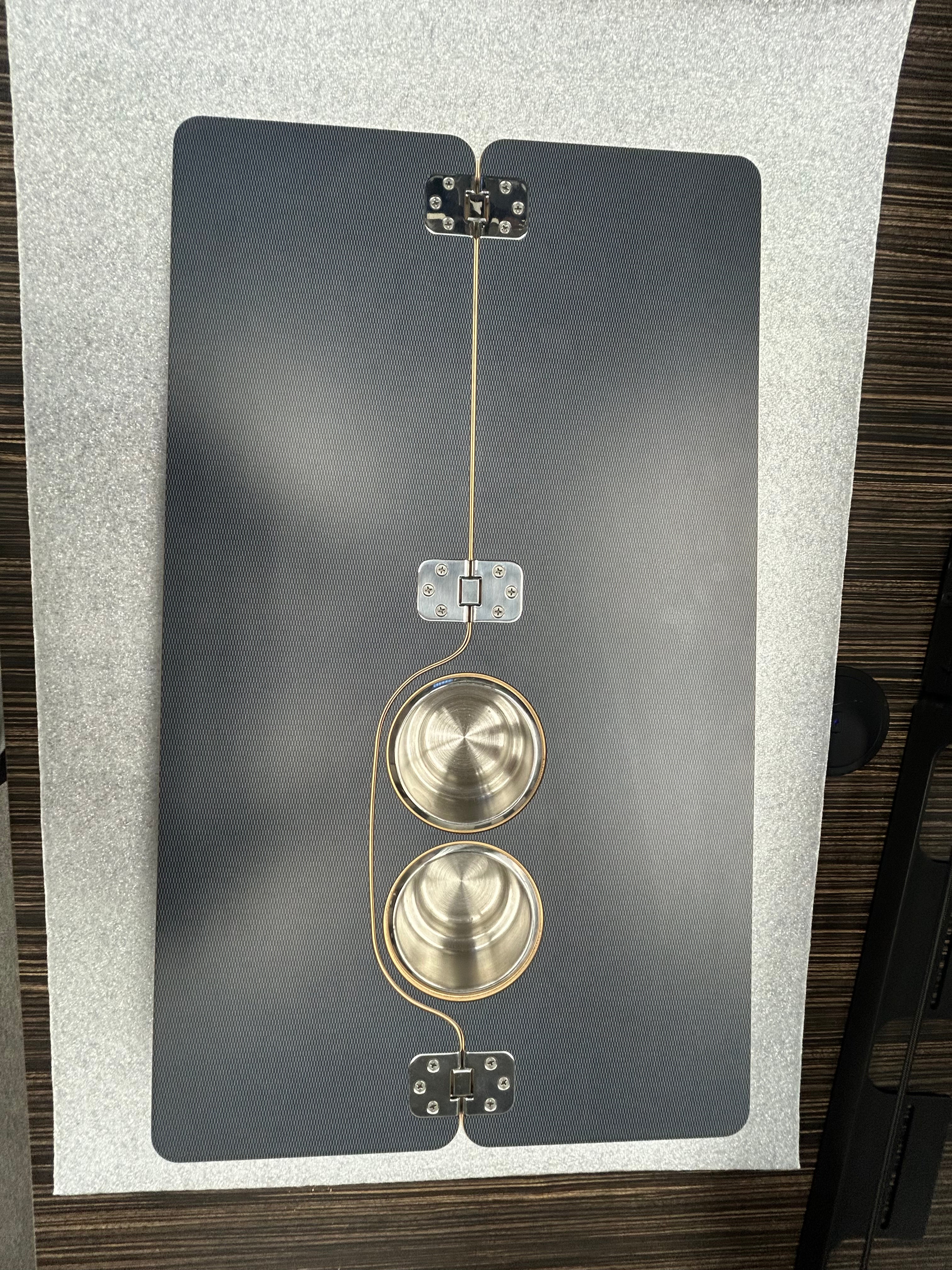 Skinny 2.0 folding table top with two recessed cup holders, mounted inside a van interior.