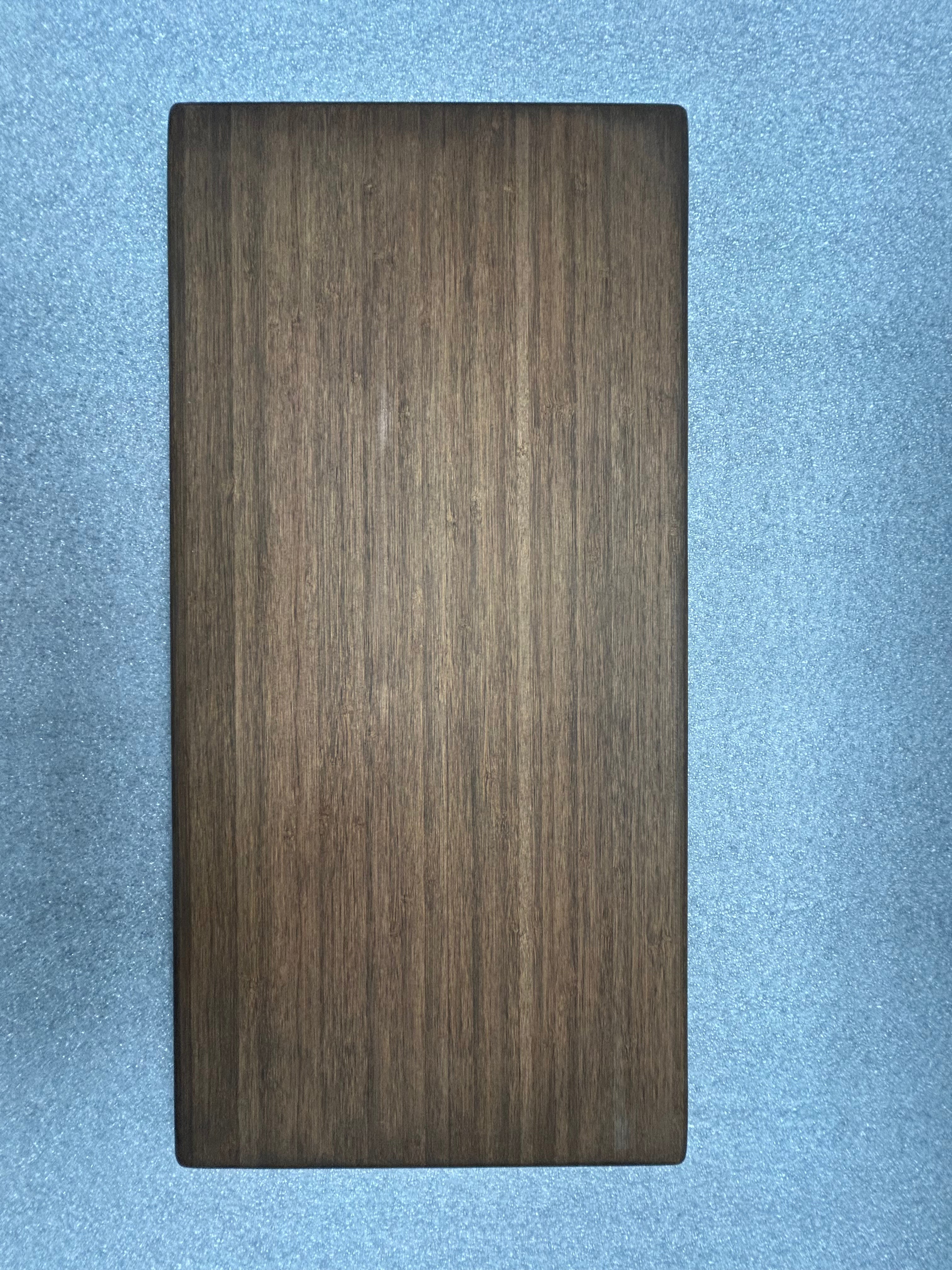 Small rectangular wood tabletop from the Small Universal collection, shown against a blue background.