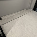 Luxe6 memory foam 6-inch mattress set up in a van interior with light gray upholstery.