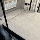 Luxe6 memory foam 6-inch mattress laid flat in a van sleeping area with light gray upholstery.