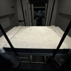 Luxe6 Memory Foam 6 Mattress set up in the rear sleeping area of a van interior.