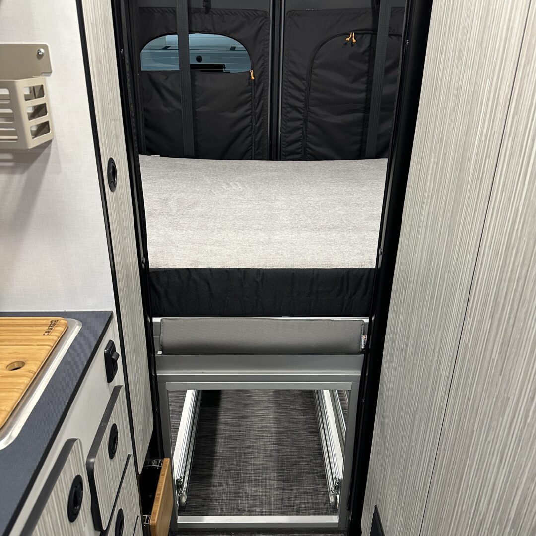 The inside of an RV with a Luxe6 Cool Gel Memory Foam 6" Mattress - Made for the REVEL/TERRAIN/LAUNCH on the bed.