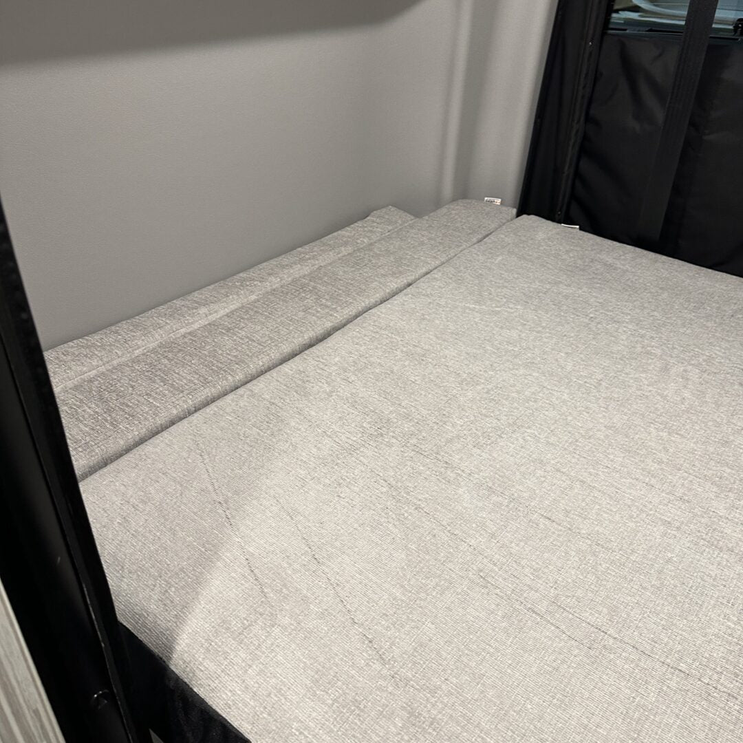 A cozy bed in a small room with a Luxe6 Cool Gel Memory Foam 6" Mattress - Made for the REVEL/TERRAIN/LAUNCH.