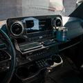 CAV D-ash Tray installed in a Mercedes-Benz van dash, holding a phone and mug.