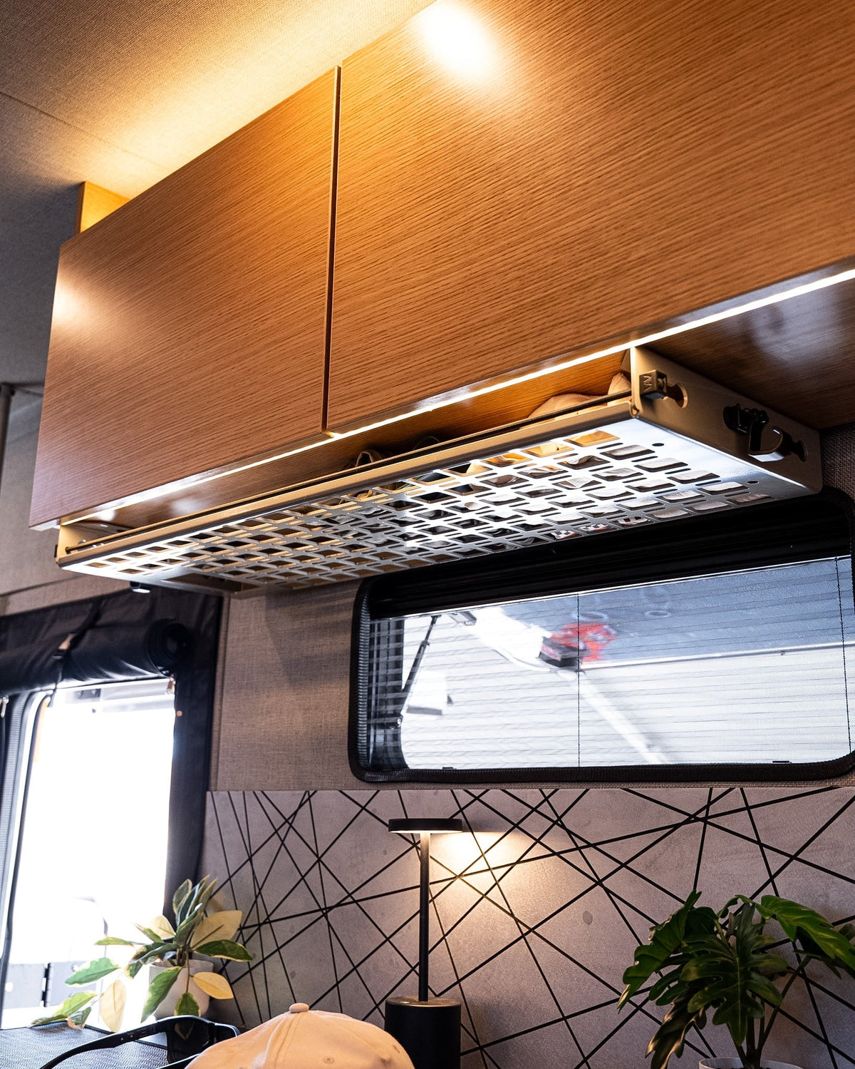 Rossmonster Passenger Undercabinet Shelf installed in a van interior
