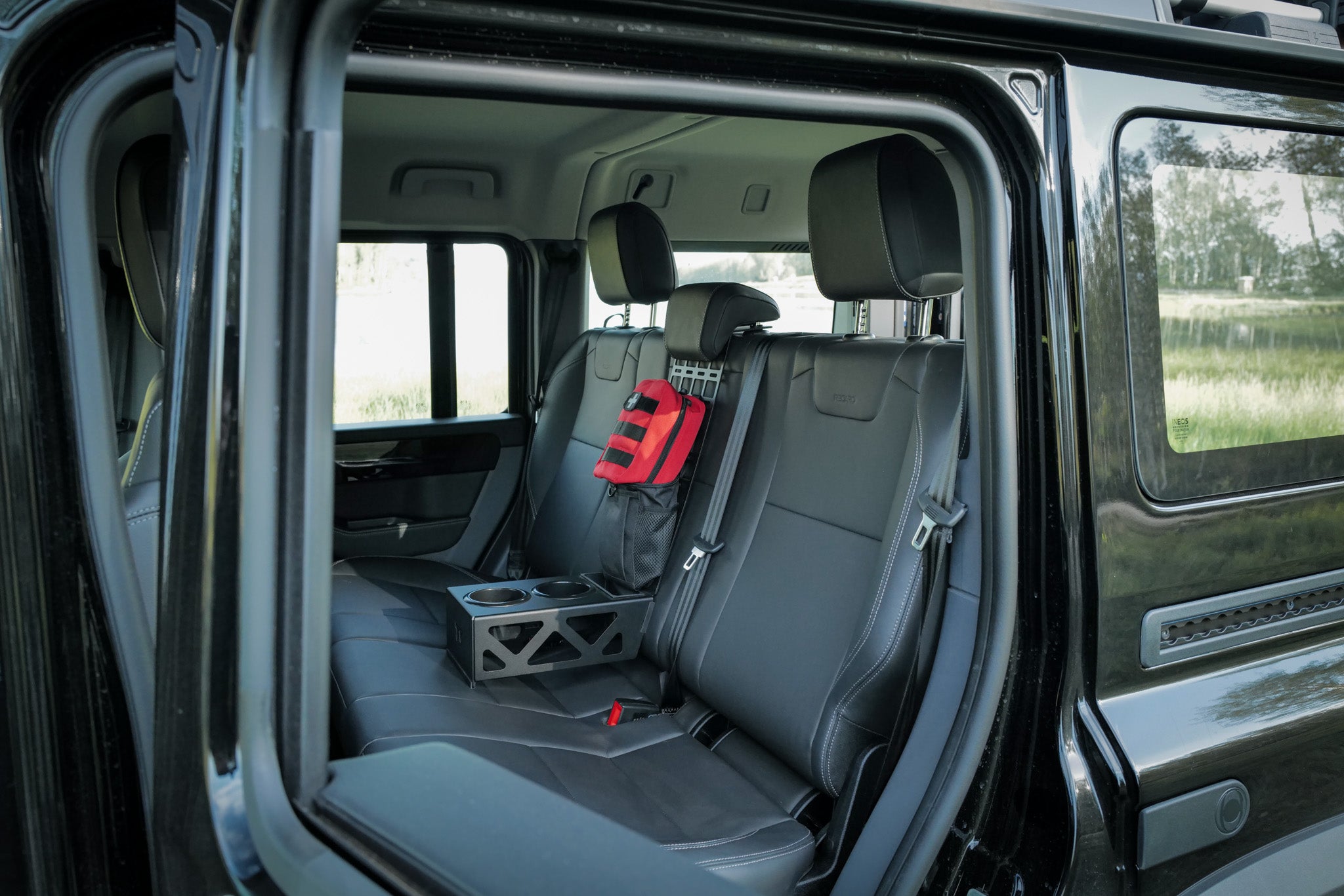 INEOS Grenadier rear seat cup holder storage tray and molle panel