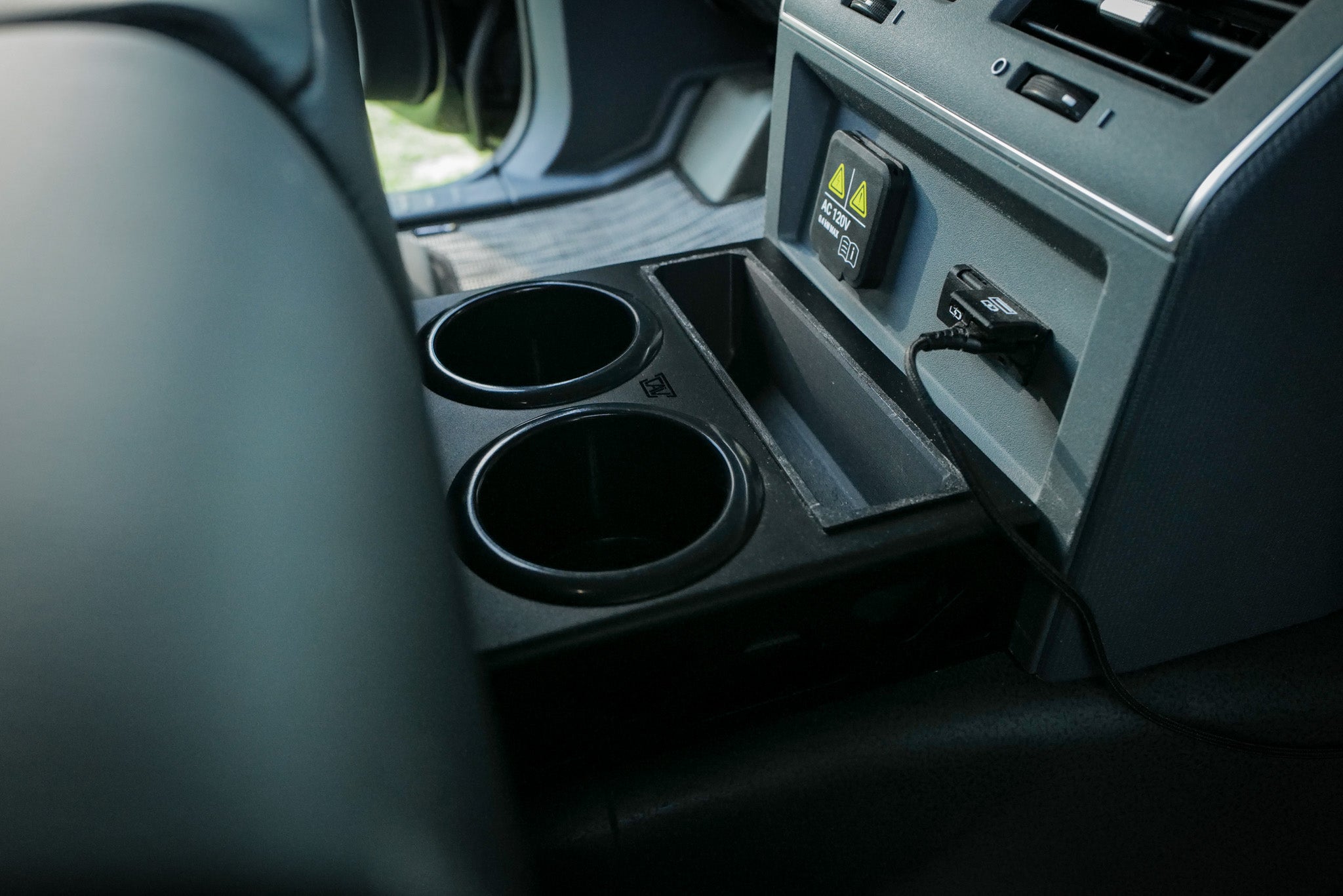 INEOS Grenadier Rear Cup Holders in the rear passenger seat