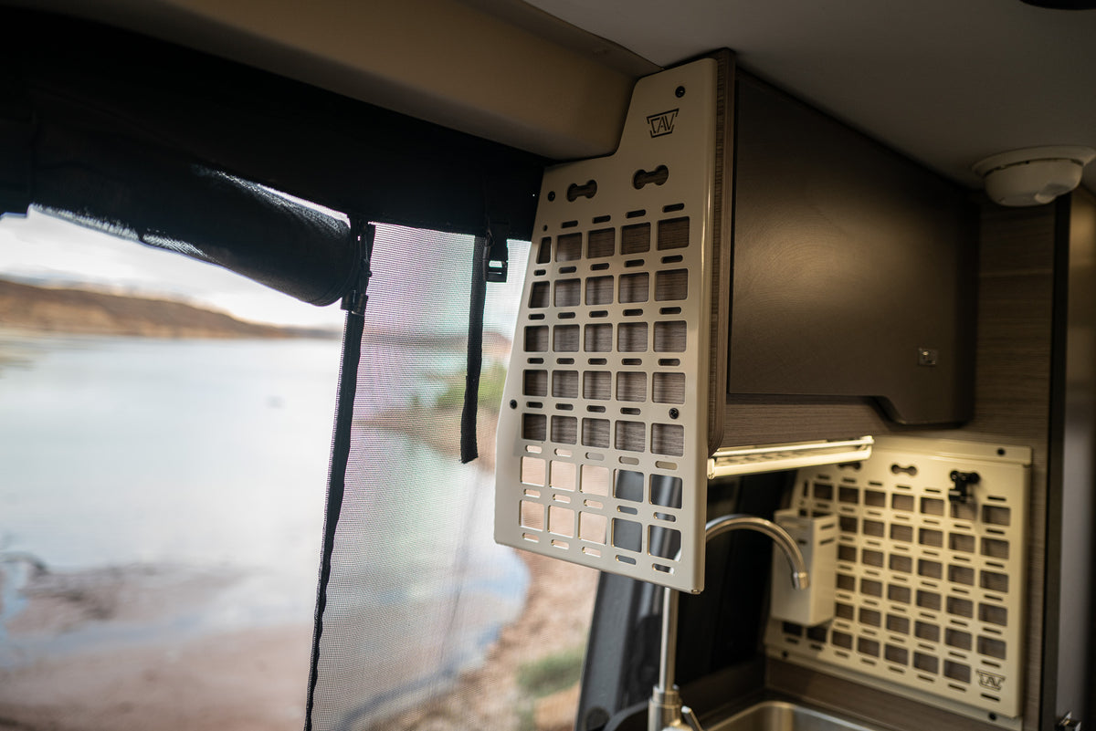 Canyon Adventure Vans Kitchen Caddy MOLLE Panel installed on the kitchen cabinet in a Jayco Terrain or Entegra Launch camper van.