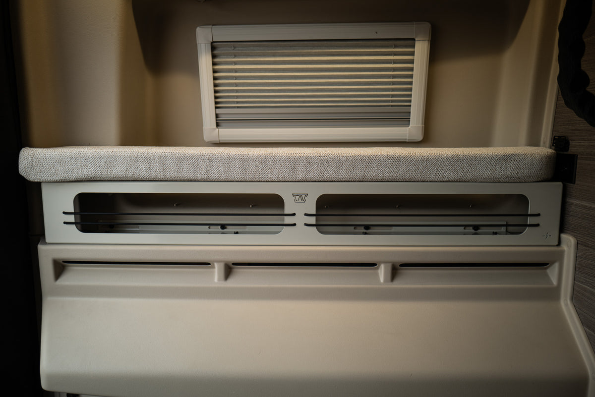 Front view of Canyon Adventure Vans 6-inch bed riser with UltraLuxe-style cushion and dual storage openings.
