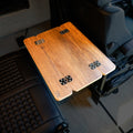 CAV Mini Skinny folding table top set up between van seats with wood finish and black hardware