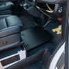 CAV Passenger Foot Platform installed between front seats in a van interior