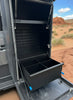 Open Canyon Drawer System by Canyon Vans showing deep storage compartments in the back of a van.