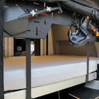 CAV ultra luxe Dream Sheets on a bed inside a modern van interior with overhead storage