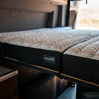 CAVANS mattress in a Storyteller Overland MODE van with quilted top and split design setup.
