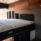 CAVAN ultra luxe mattress in a Storyteller Overland MODE van interior with wood cabinetry
