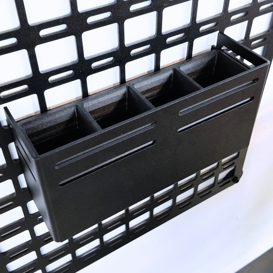 cav molle shelf caddy attached by hooks on black molle panel with black aluminum powdercoated and 4 compartments for utensil storage