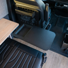 Revel Canyon Table Top extended near the drivers seat in a van interior.