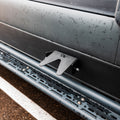 CAV magnetic bike stand mounted on the side of a van near the step rail