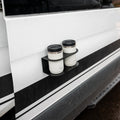 Revel Magnetic Dual Cupholder holding two mugs on the exterior of a van door