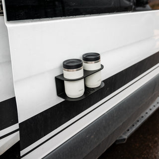 Revel Magnetic Dual Cupholder holding two mugs on the exterior of a van door