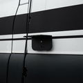 Magnetic fly rod holder by Storyteller mounted on the side of a van with fishing rods attached