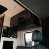 Revel Under-Microwave Shelf installed beneath a black microwave inside a van interior.