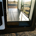 canyon ekko garage platform installed in winnebago ekko mercedes sprinter van for storage shows with doors open
